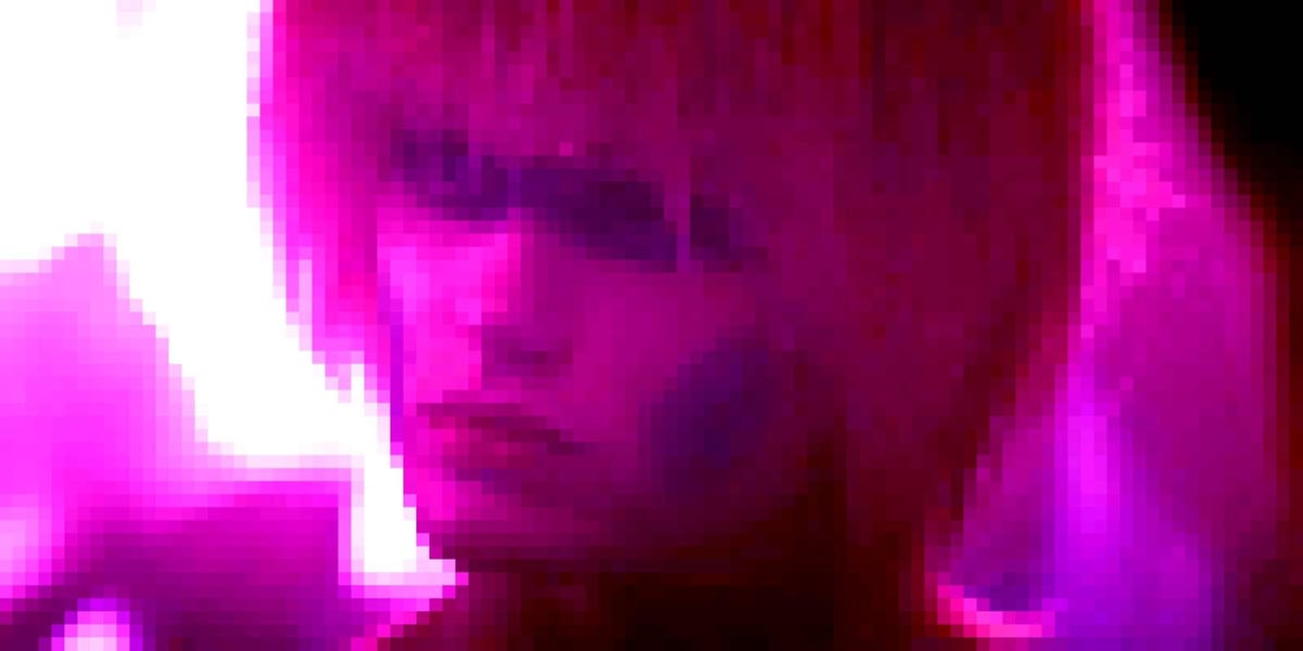 Daryl Hannah from Blade runner with black around her eyes an a mop of blonde hair. The image is pixelated and pink